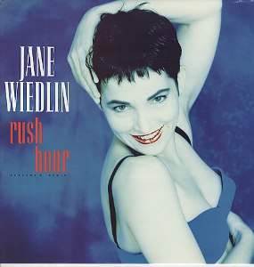 “Rush Hour” by Jane Wiedlin: Neon Nerves, New Wave Cool, and the Art of Controlled Chaos